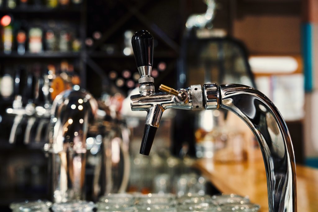 Selective focus of modern beer taps in pub